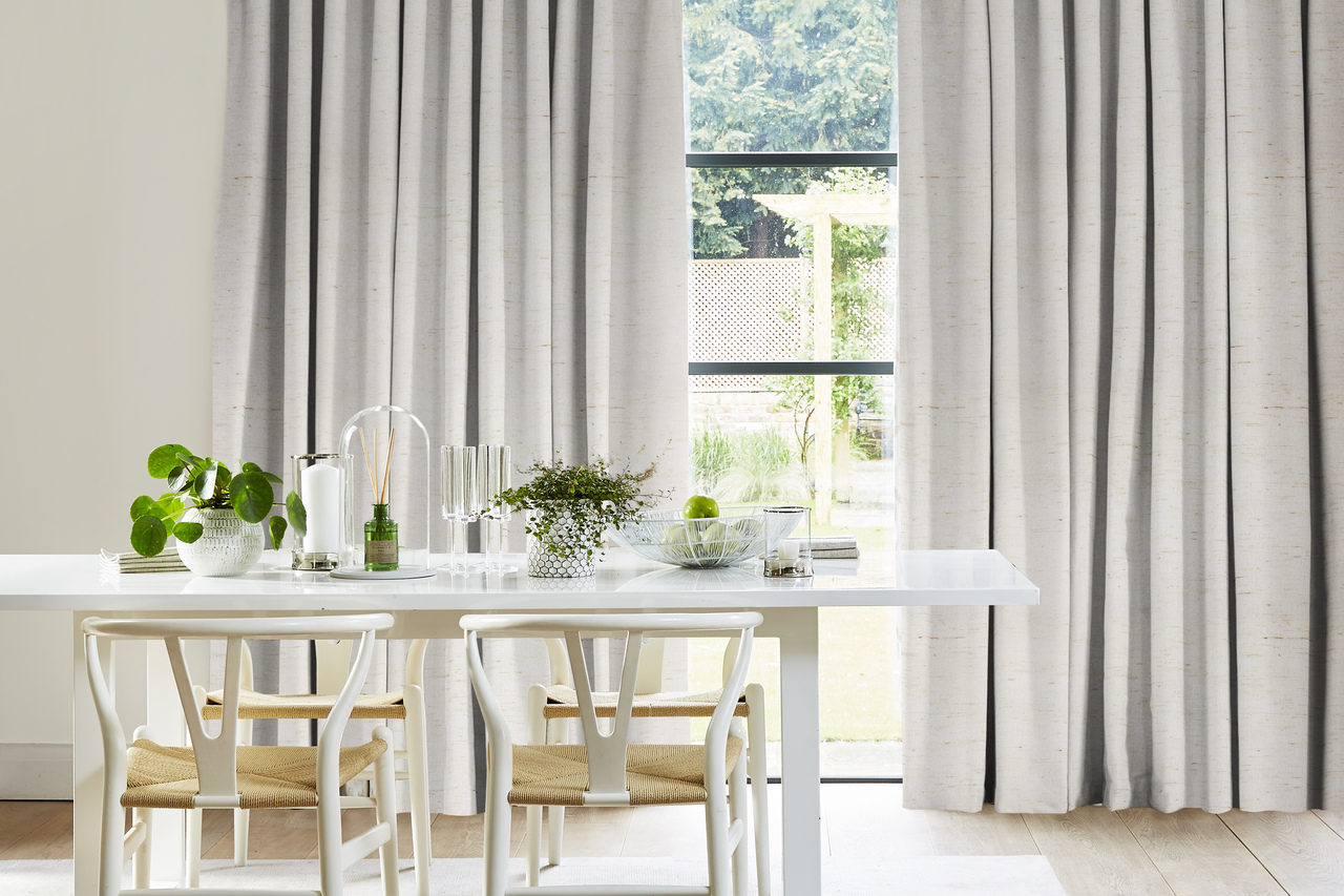 white blockout curtain in dining room with a table and chairs