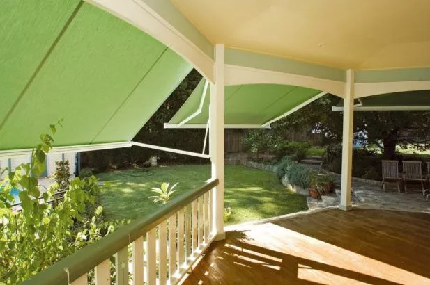 Green Celebration Folding Arm Awnings Extended From A Home Verandah Victory 1 617X410
