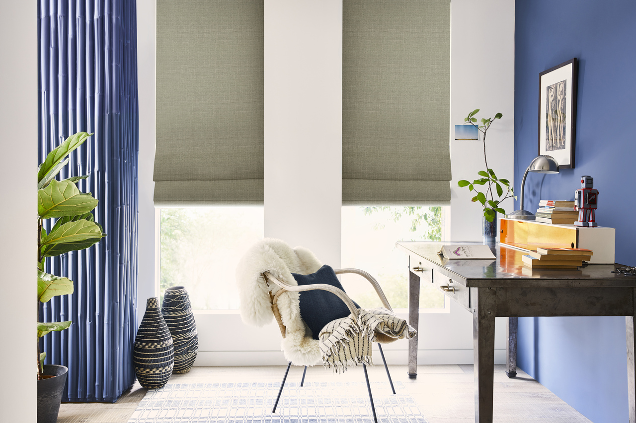 Office room with blue walls chair desk dual roman blinds