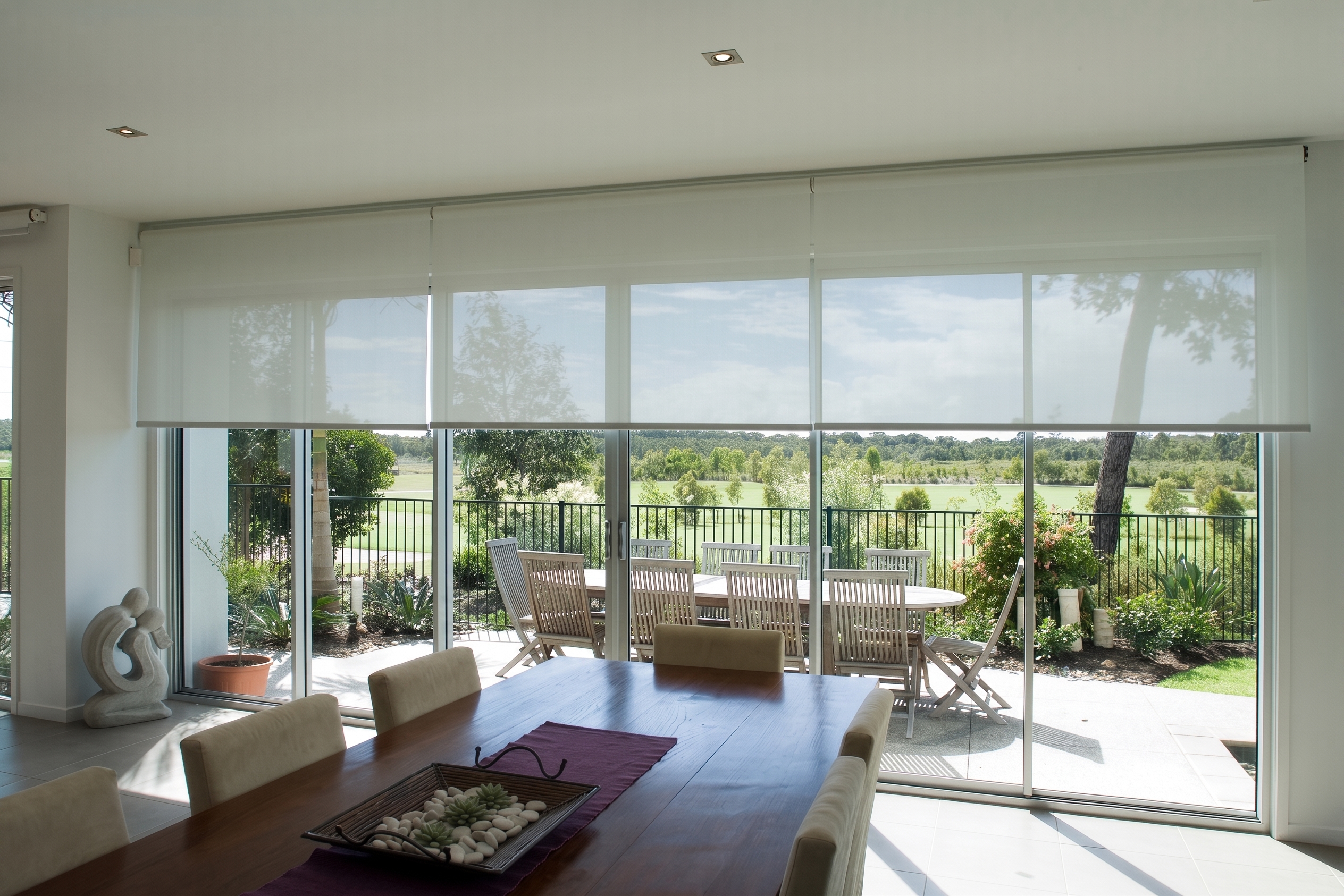 Roller Blinds In Dining Room Overlooking Alfresco Space