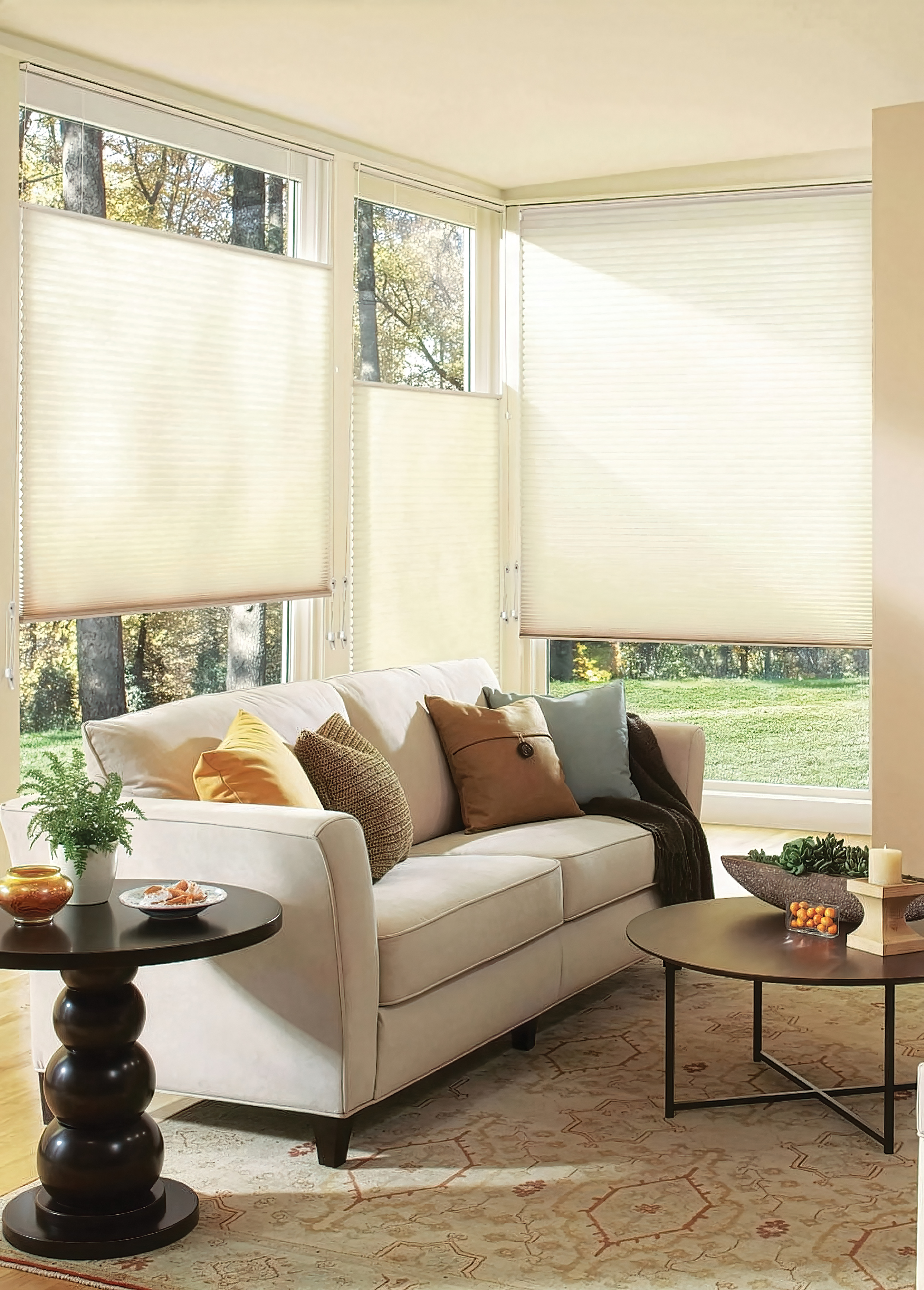 Cream honeycomb blinds with gentle sunlight filtering through