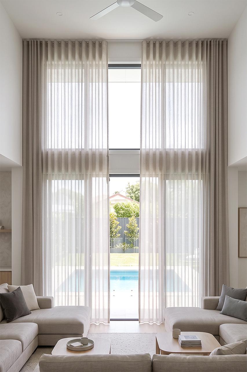 Floor to ceiling double height veri-shade curtains overlooking a backyard pool